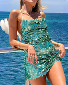 Teal blue sequin mini dress with spaghetti straps and layered disc pattern