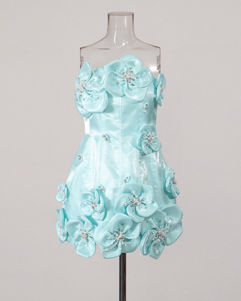 Sky blue strapless corset mini dress on mannequin with 3D floral appliques and rhinestones
