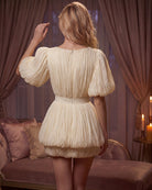 Champagne pleated mini dress with puff sleeves, open back, and rosette waist detail