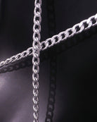 Silver chain links and connector rings detail on diamond-cut PVC mesh