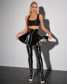 Black wet-look pleated mini skirt with flared pleats and shiny finish