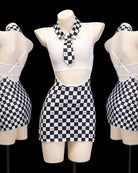 Black-and-white checkered mini skirt and halter top set on mannequins