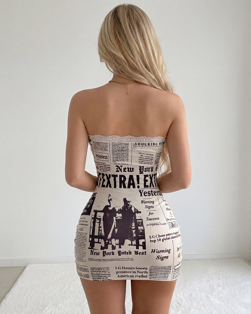 Sheer mesh mini dress with newspaper print, open-back strapless design