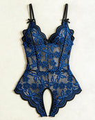 Black and blue floral lace crotchless teddy with v-neck and bow straps, flat lay