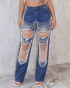 Light blue denim jeans with pearl chain drape across front