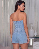 Light blue denim strapless bandeau top and high-rise shorts set shown from the back
