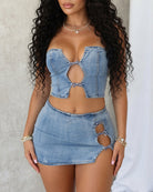 Light blue denim bustier crop top with oval cutout and bow, mini skirt