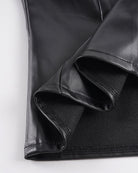 Black PU leather shorts leg, stitched cuff fold with smooth fabric texture