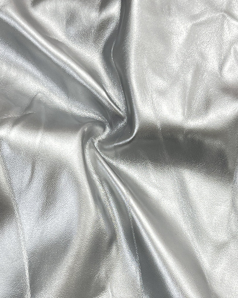 Silver PU leather fabric texture with soft sheen and smooth surface