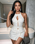 White halter cut-out peplum top and wrap mini skirt set with ribbon-like bow detail