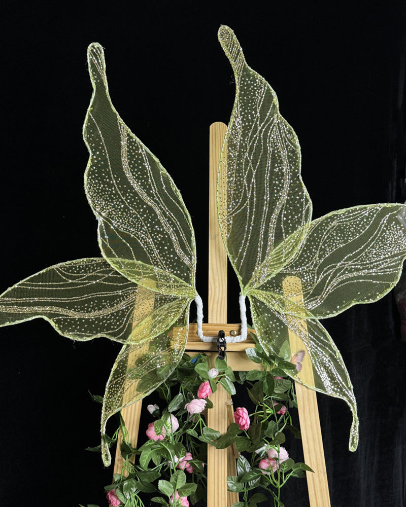 Glitter fairy wings accessory in yellow-green with shimmering, vein-like sparkle lines