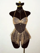 Gold rhinestone halter mini dress with mesh fringe hem on a mannequin