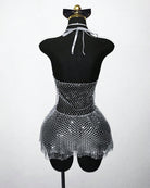 Back view: silver mesh halter mini dress with rhinestone fringe hem on mannequin