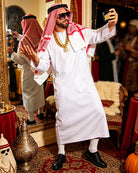 White Arabian sheikh robe set with red check headscarf, gold chain, black shoes