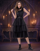 Black tiered sleeveless tulle midi dress with ruffled lace collar and waist belt.