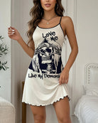 Cream mini slip dress with skull graphic front, spaghetti straps, scalloped hem