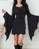 Black mini dress with lace-up neckline, long batwing sleeves, short hem