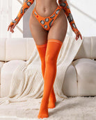 Over-the-knee socks in orange with ribbed cuff, long smooth knit on legs