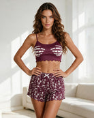 Purple skeleton-print cami crop top with scalloped hem and matching pajama shorts