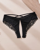 Black lace crotchless panties with criss-cross front straps and scalloped edges