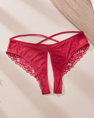 Red satin-like crotchless panties with lace trim and criss-cross strap design
