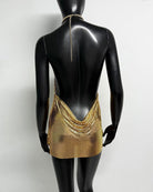 Gold metallic chain halter mini dress with open back and crisscross chain halter