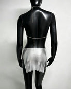 Silver metallic chain bra top and mini skirt set on mannequin, open back chains