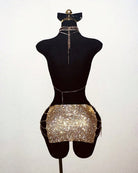 Gold rhinestone halter top and mini skirt set on mannequin with long chain ties