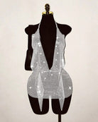 Silver rhinestone fishnet halter mini dress on mannequin with open-back design