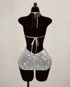 Silver rhinestone fishnet halter mini dress with tie halter and open-back cutout