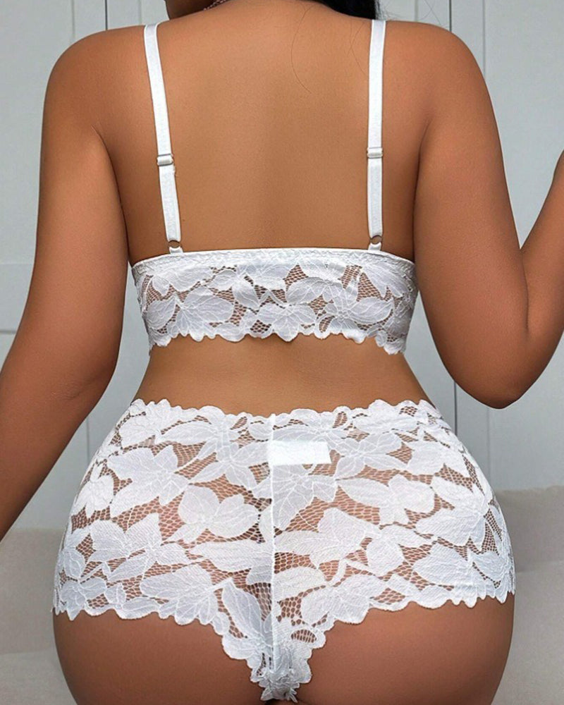 Back view of white floral lace bra with adjustable straps and matching lace shorts