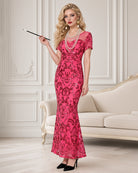 Pink sequin maxi dress with high slit, short sleeves, fitted column silhouette