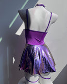 Side/back view of holographic purple mini dress with halter harness and garter straps