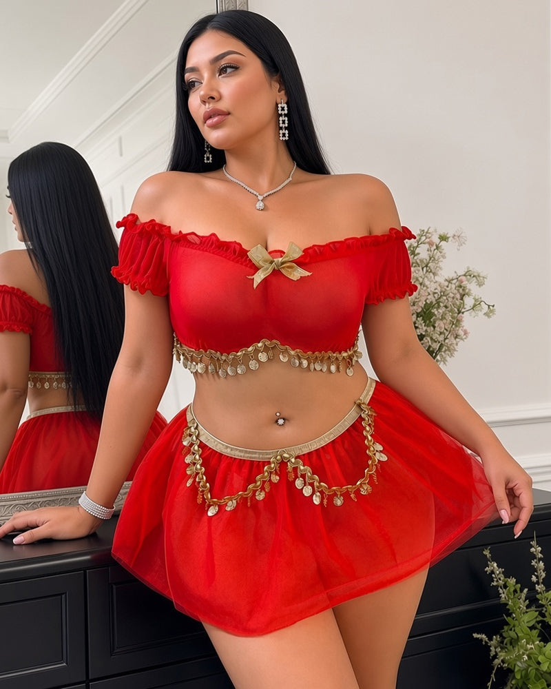 Red off-shoulder sheer crop top with bow detail, tulle mini skirt, gold coin chain belt