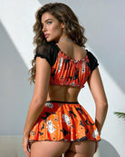 Orange ghost cat print satin set with black ruffled off-shoulder crop top and mini skirt