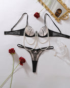 Black floral lace lingerie set: bra, thong panty, and pearl chain accessories