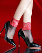 Lace-trim sheer ankle socks with red lace cuffs and dark sheer legs, worn with heels.