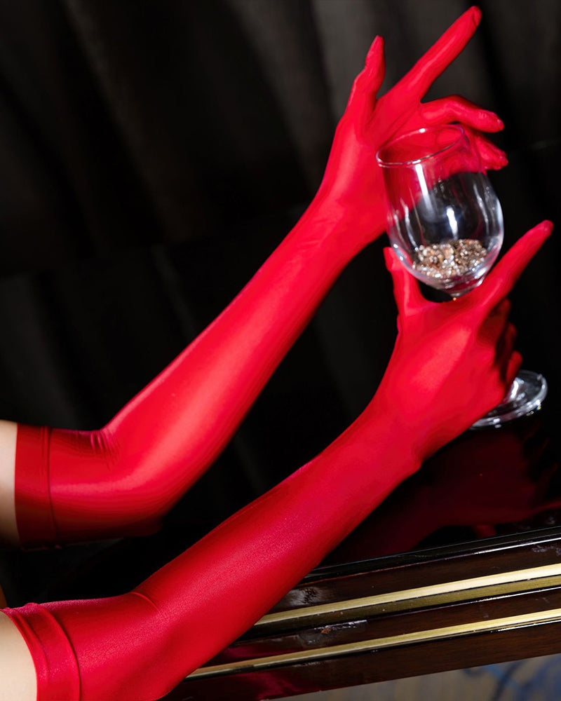 Red oil-shiny sheer opera gloves with long fitted sleeves and subtle seam detail
