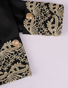 Baroque prince costume sleeve and cuff, black with gold embroidered filigree trim