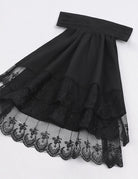 Black ruffled shirt hem with layered lace trim and gathered skirt front