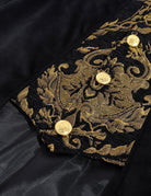 Gold baroque embroidered trim with round buttons on a black coat front