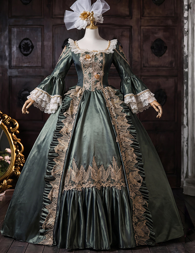 Dark green medieval court gown on mannequin with ornate gold embroidery and lace cuffs