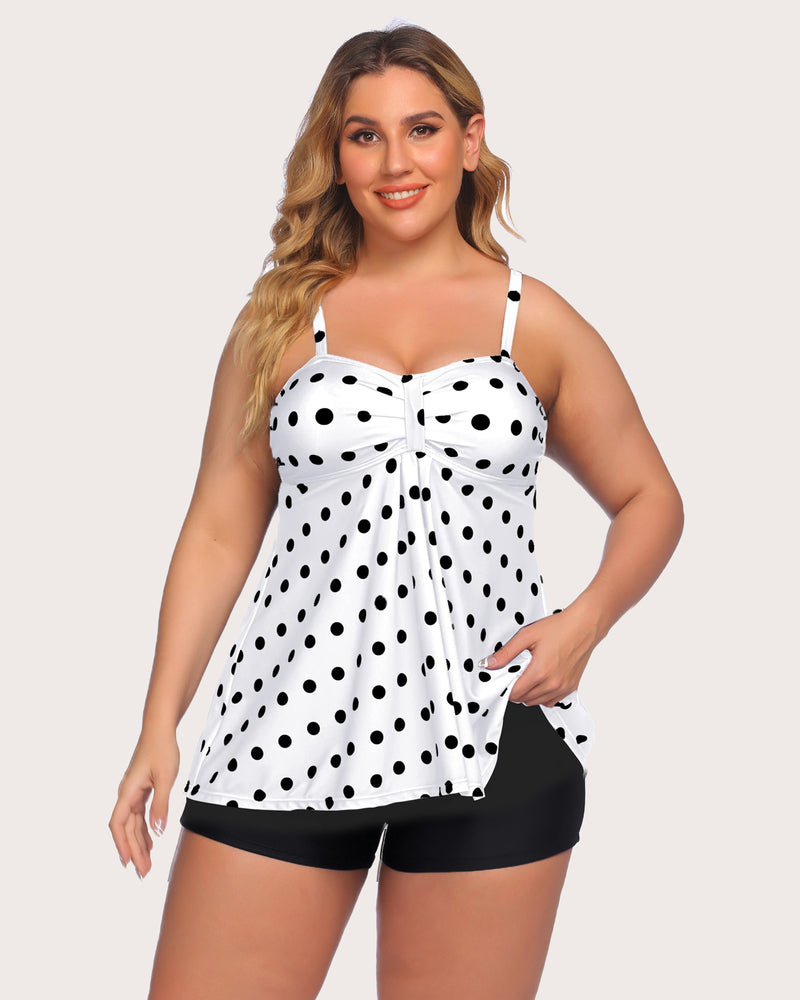 Two-piece tankini set with white tankini covered in black dots and black swim shorts