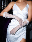 White heart-print mesh gloves with sheer fingers and ruffled lace wrists