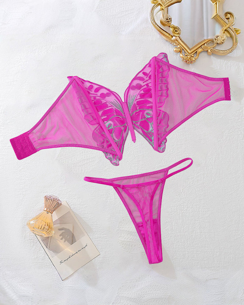 Rose red butterfly bra and thong lingerie set, flat lay with jewelry and tags
