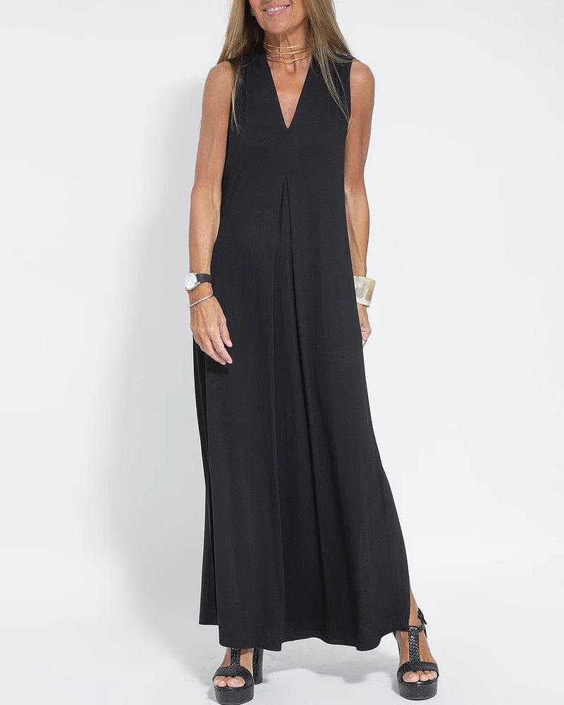 Black sleeveless maxi dress with V-neck and long flowy skirt, side slit