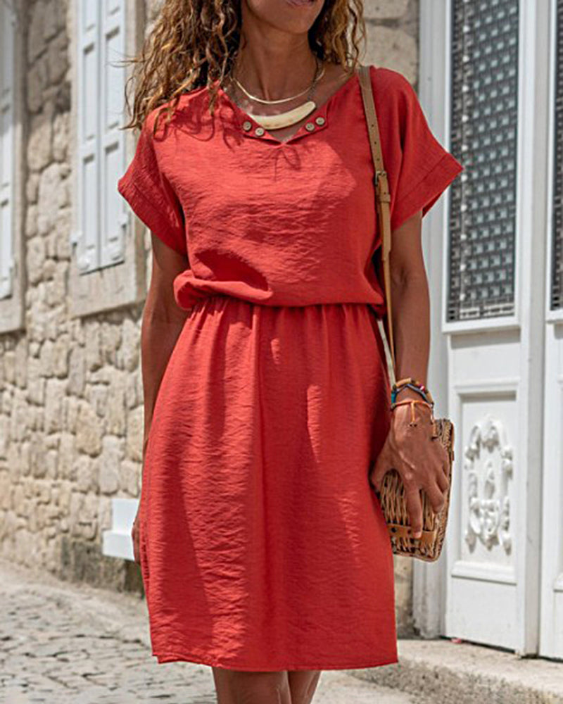 Red mid dress with short sleeves and buttoned V neckline, gathered waist