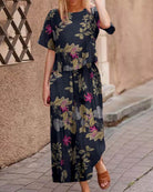 Navy floral two-piece set with short-sleeve top and matching wide-leg pants