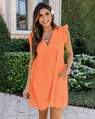 Orange lace dress with V-neck and ruffled cap sleeves, eyelet pattern, side pockets