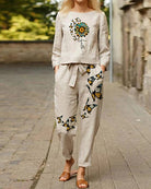 Light taupe print tracksuit set with butterfly and floral motif, long sleeves and jogger pants